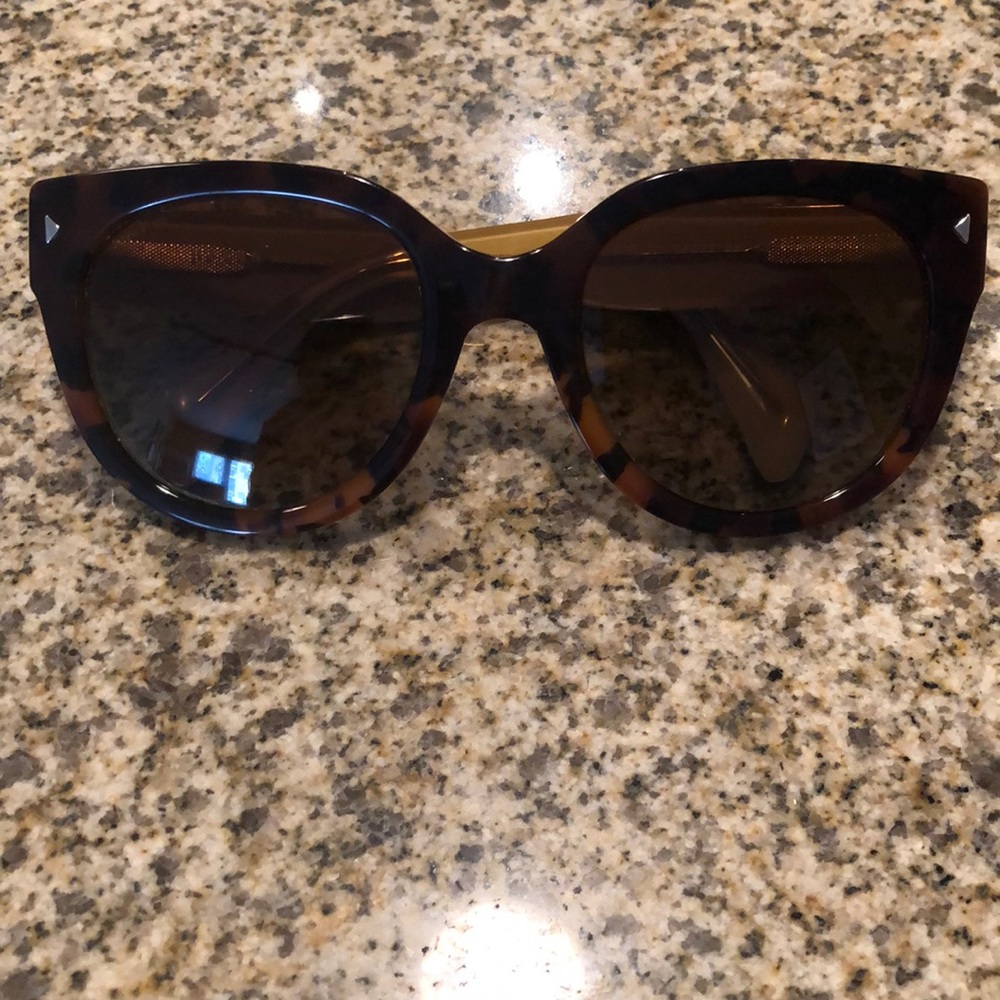 Tortoise Prada polarized sunglasses.